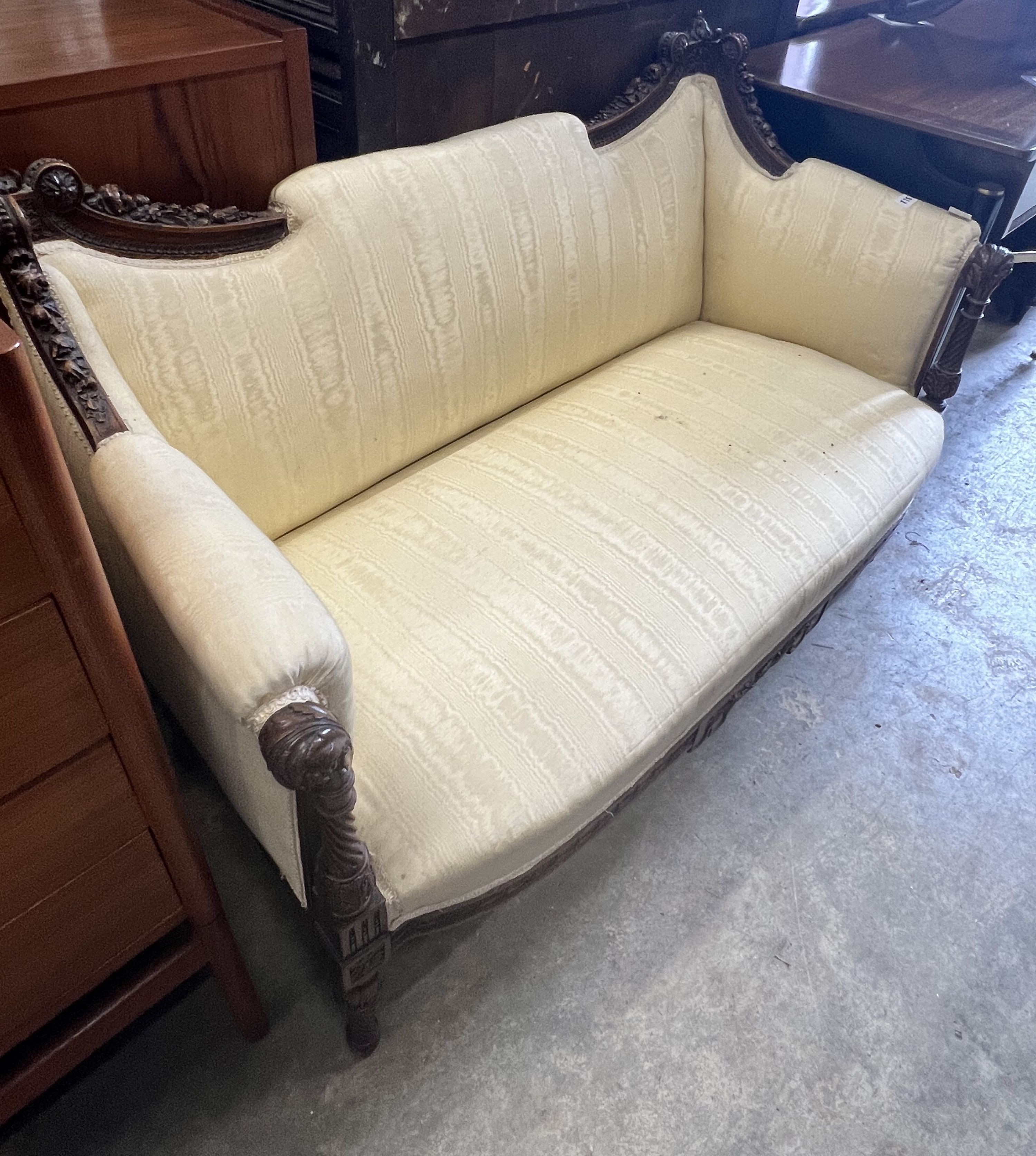An early 20th century French carved walnut canapé, width 122cm depth 58cm height 81cm